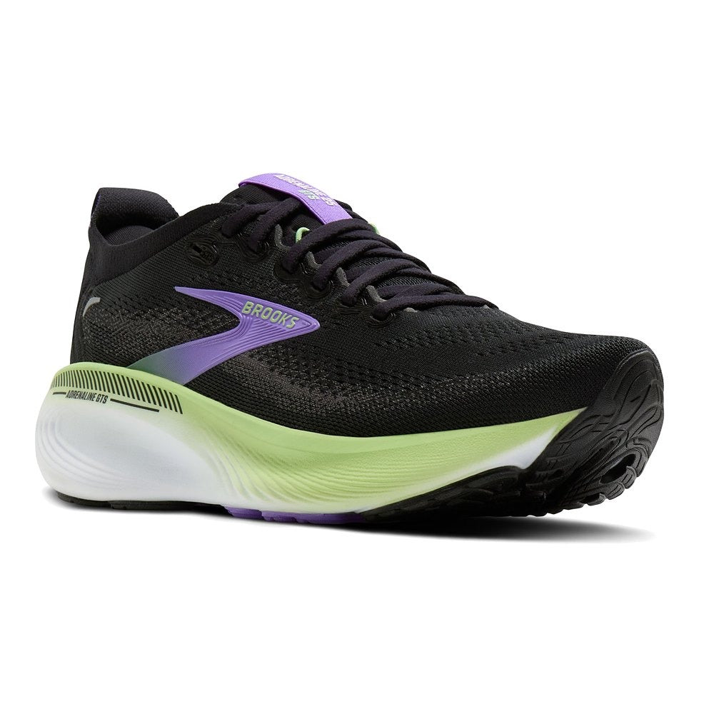 Zapatilla Brooks Adrenaline GTS 25 negra y lila, vista frontal en ángulo, detalle de la puntera, los cordones y la mediasuela verde