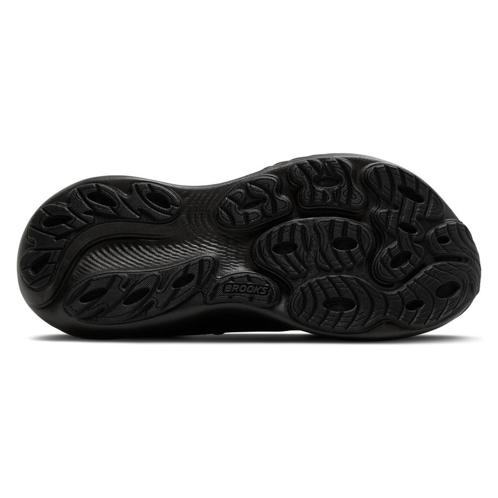 Suela de caucho de la zapatilla Brooks Adrenaline GTS 25 negra, vista inferior con el dibujo de los tacos