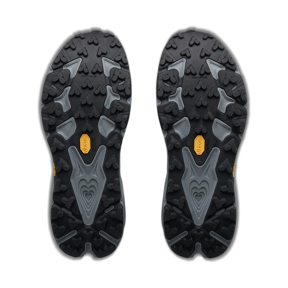 Suela de tacos Vibram Megagrip de 5 mm de la Hoka Speedgoat 7 azul y gris, vista inferior del par